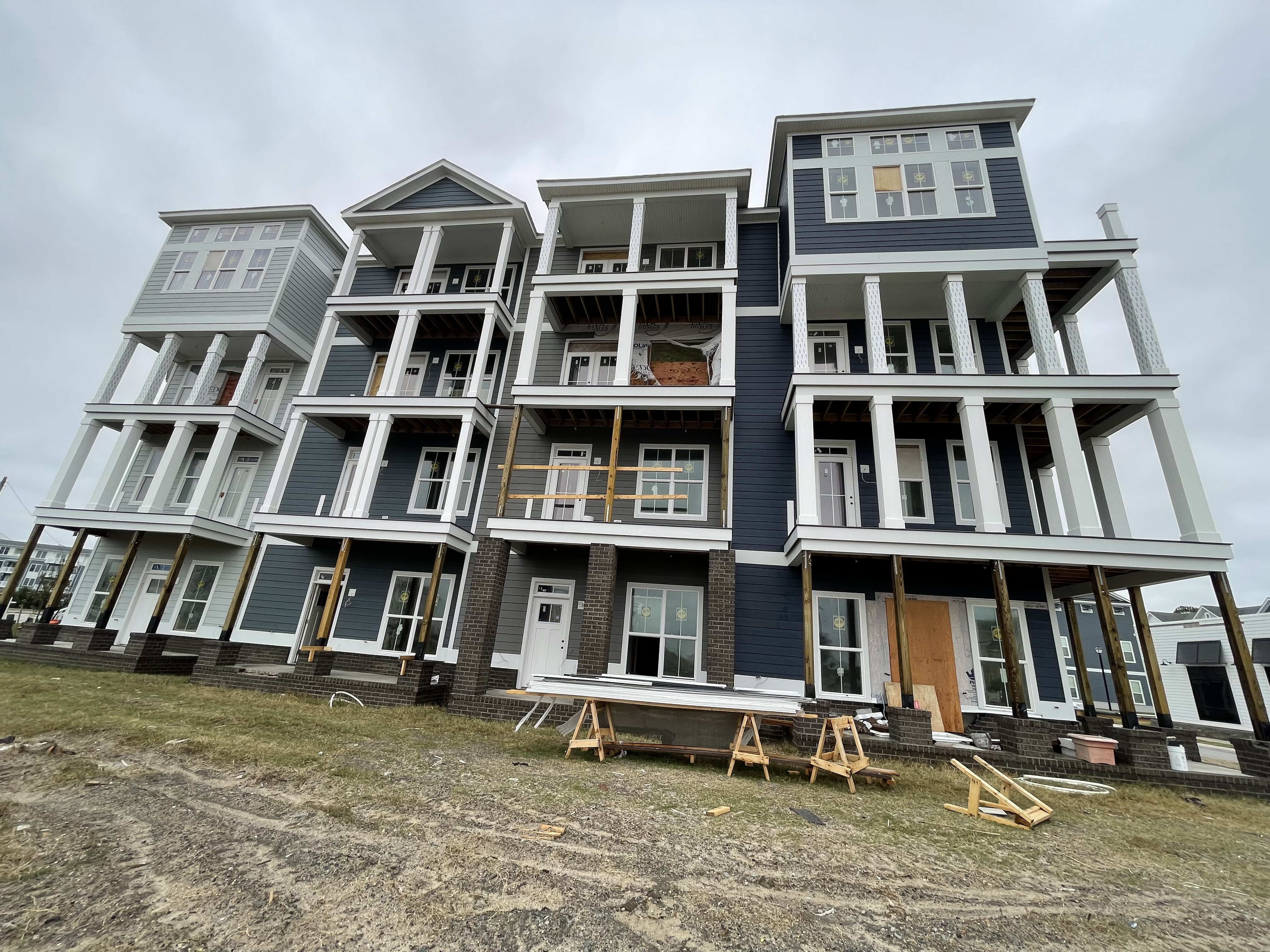 Navy coastal townhomes with balconies